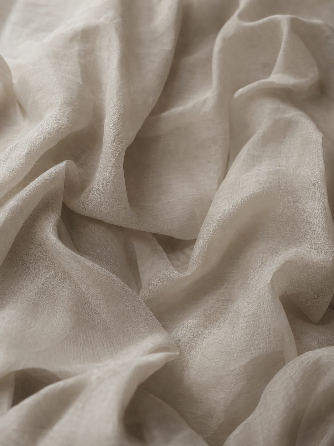 Raw silk falling in soft folds, filling the frame